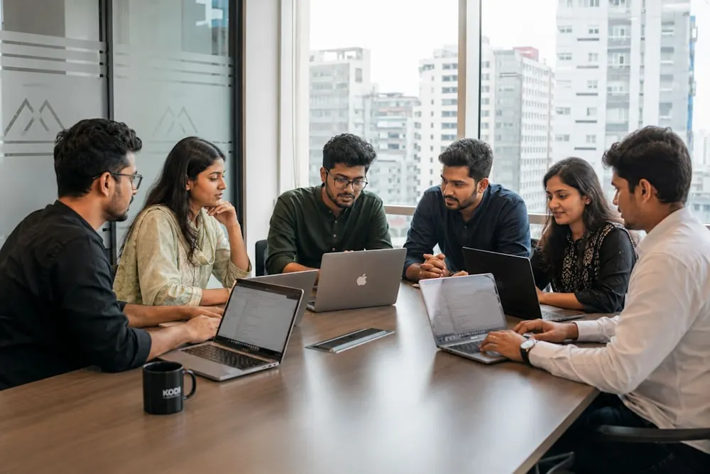The Access CFO finance team reviewing client reports together in a modern office