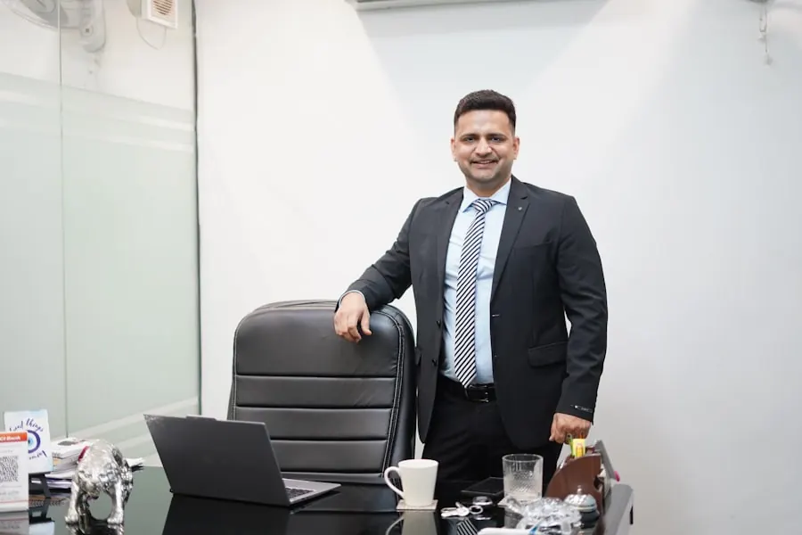 An Indian business owner reviewing figures in his office